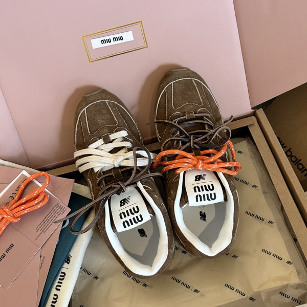 M*um*u x new balance sneaker